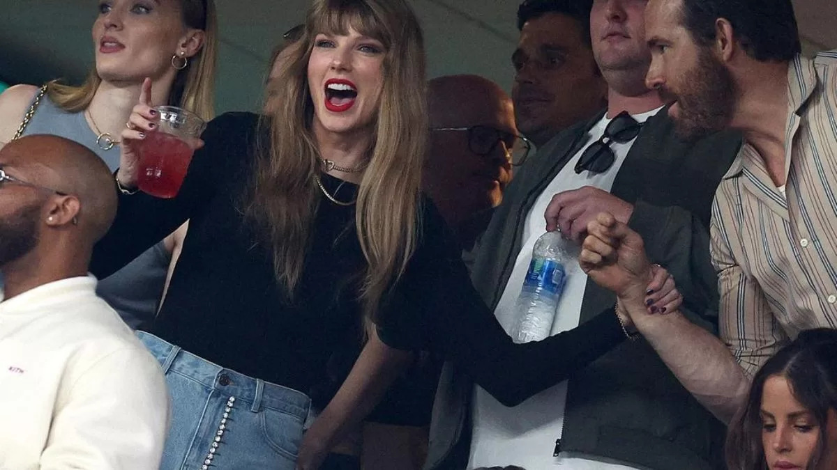 Taylor Swift joins Ryan Reynolds, Blake Lively, Hugh Jackman, and Sophie Turner at Travis Kelce's NFL game. View photos